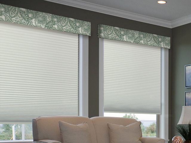Cellular shades with a fabric valance in a Central Florida sitting room