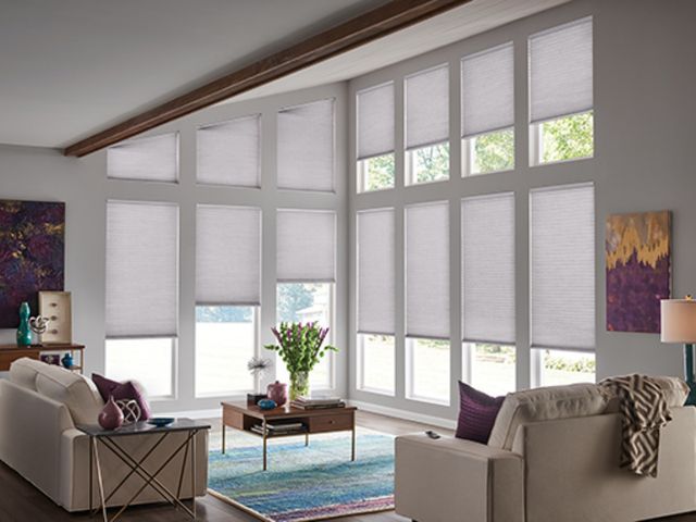 Cellular shades across a wall of great room windows