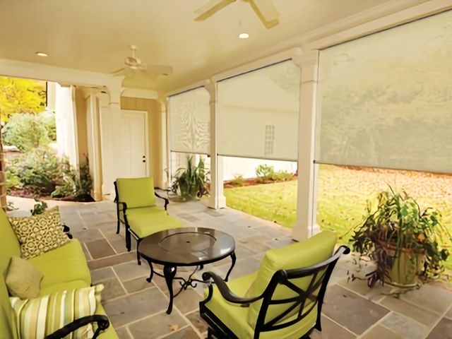 Outdoor motorized shades on a Florida patio ahead of storm season