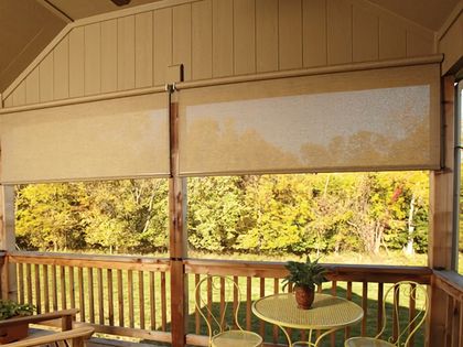 Outdoor shades on a screened porch, ready to retract ahead of a storm